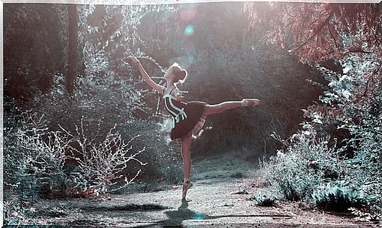 woman dancing in the forest