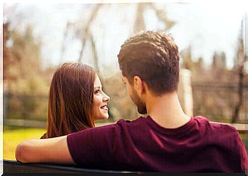 A couple sitting on a bench