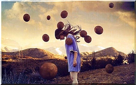 girl surrounded by balls hanging in the air