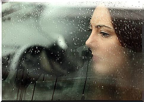 woman looking through the window